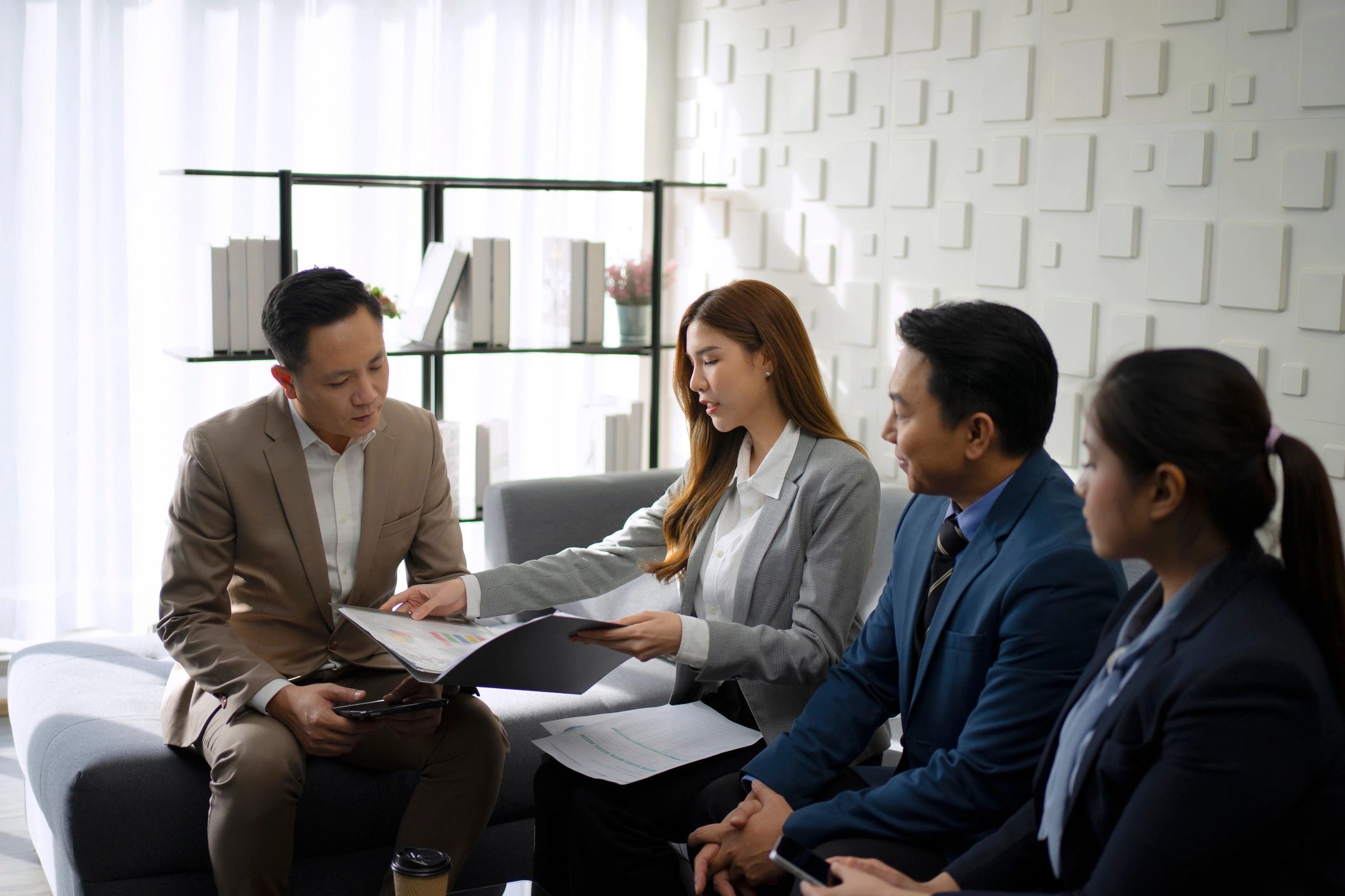 Business team reviewing work together in an office