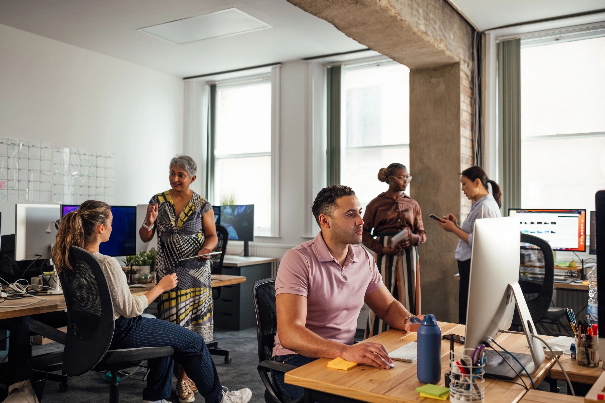 Startup finance team collaborating in a modern office